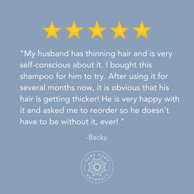 Pure Body Naturals anti hair loss label closeup shows DHT blockers and natural oils