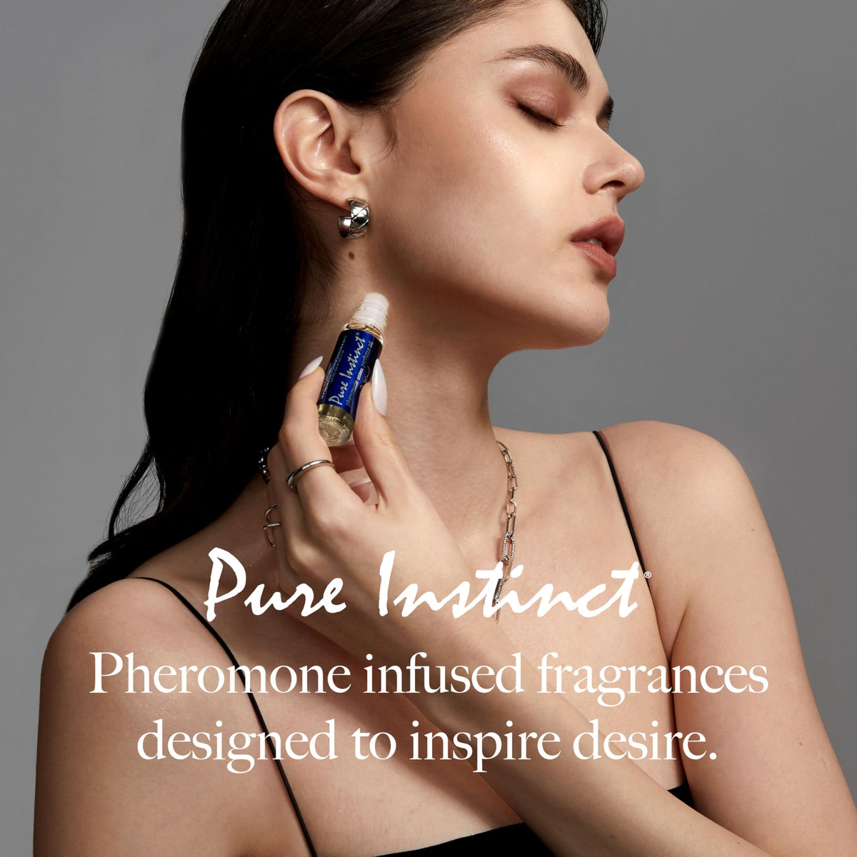 Person applying Pure Instinct Roll-On to wrist for subtle aroma.