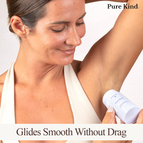 Pure Kind deodorant stick glide demonstrates smooth application with no grit or residue.