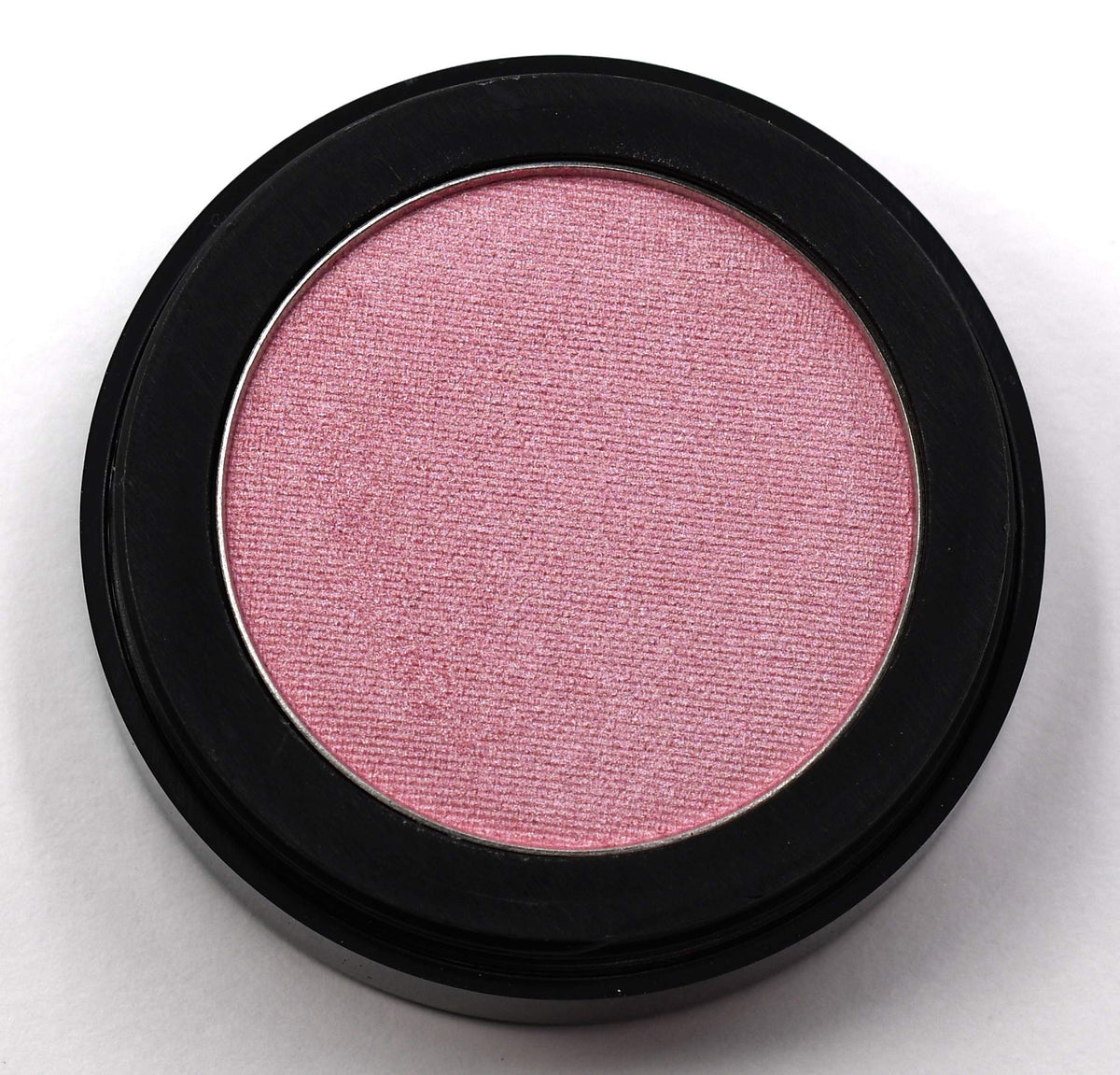 Pure Ziva Pink Glow arm swatch shows buildable pink opal shimmer