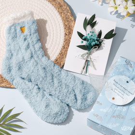 Qinline fuzzy socks provide cozy comfort during self-care moments.