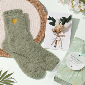Qinline fuzzy socks offering warm comfort during self-care moments