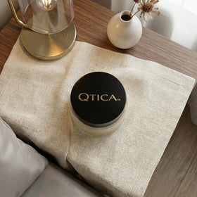 Close-up of QTICA balm texture for precise cuticle care.