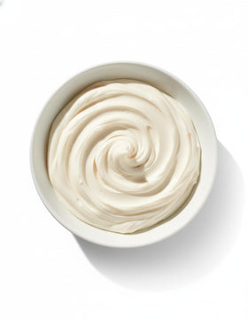 Queen Helene Cholesterol Hair Conditioning Cream label close-up highlighting nourishing formula for damaged hair