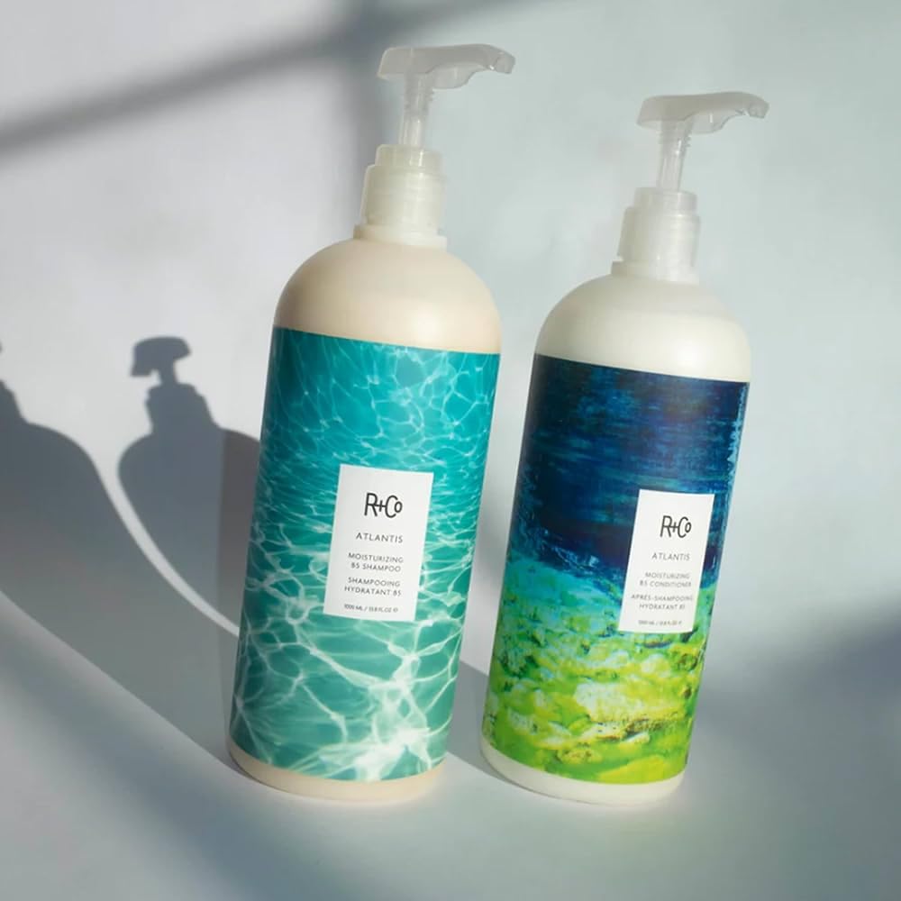 Close-up of R+Co Atlantis shampoo lather showing rich cleansing foam