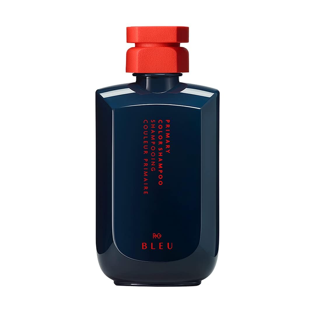 R+Co BLEU bottle pouring to highlight color protection and hydration.