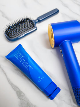 R+Co BLEU on damp hair for a natural, controlled finish.