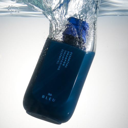 R+Co BLEU Essential Shampoo bottle front view emphasizing everyday cleansing.