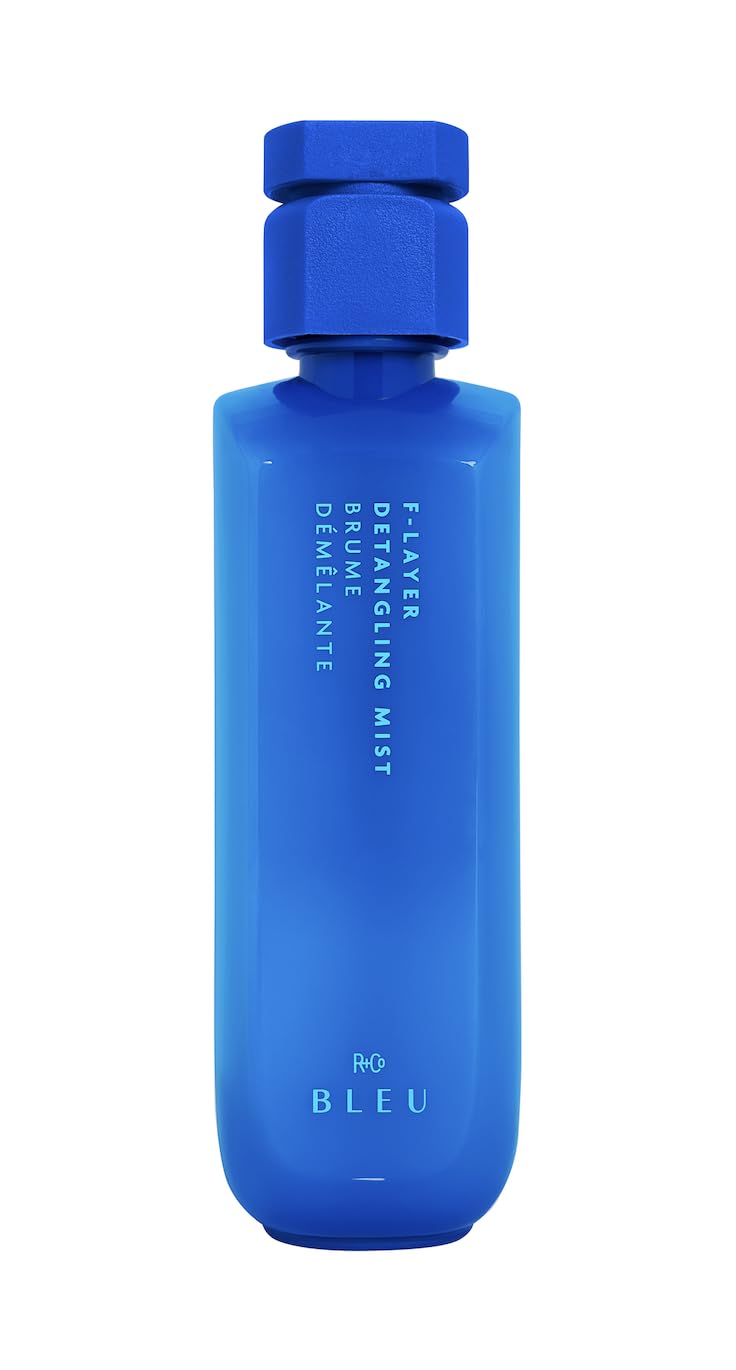 R+Co BLEU F-Layer Detangling Mist bottle, effortless detangling and frizz control.