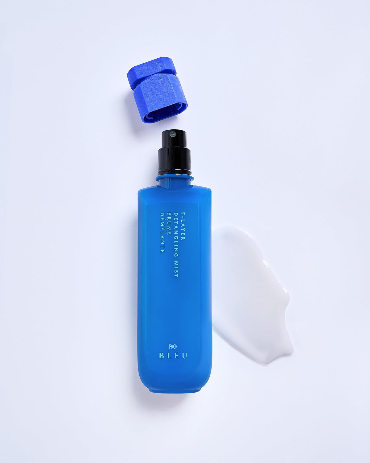 R+Co BLEU F-Layer Detangling Mist closeup, heat protection up to 450°F.