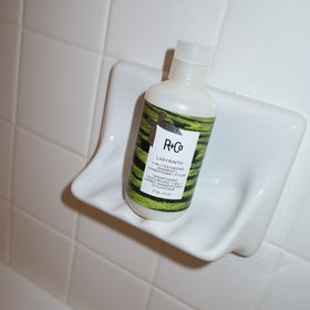 R+Co Labyrinth wet hair shower showcases clean, refreshed scalp setup.