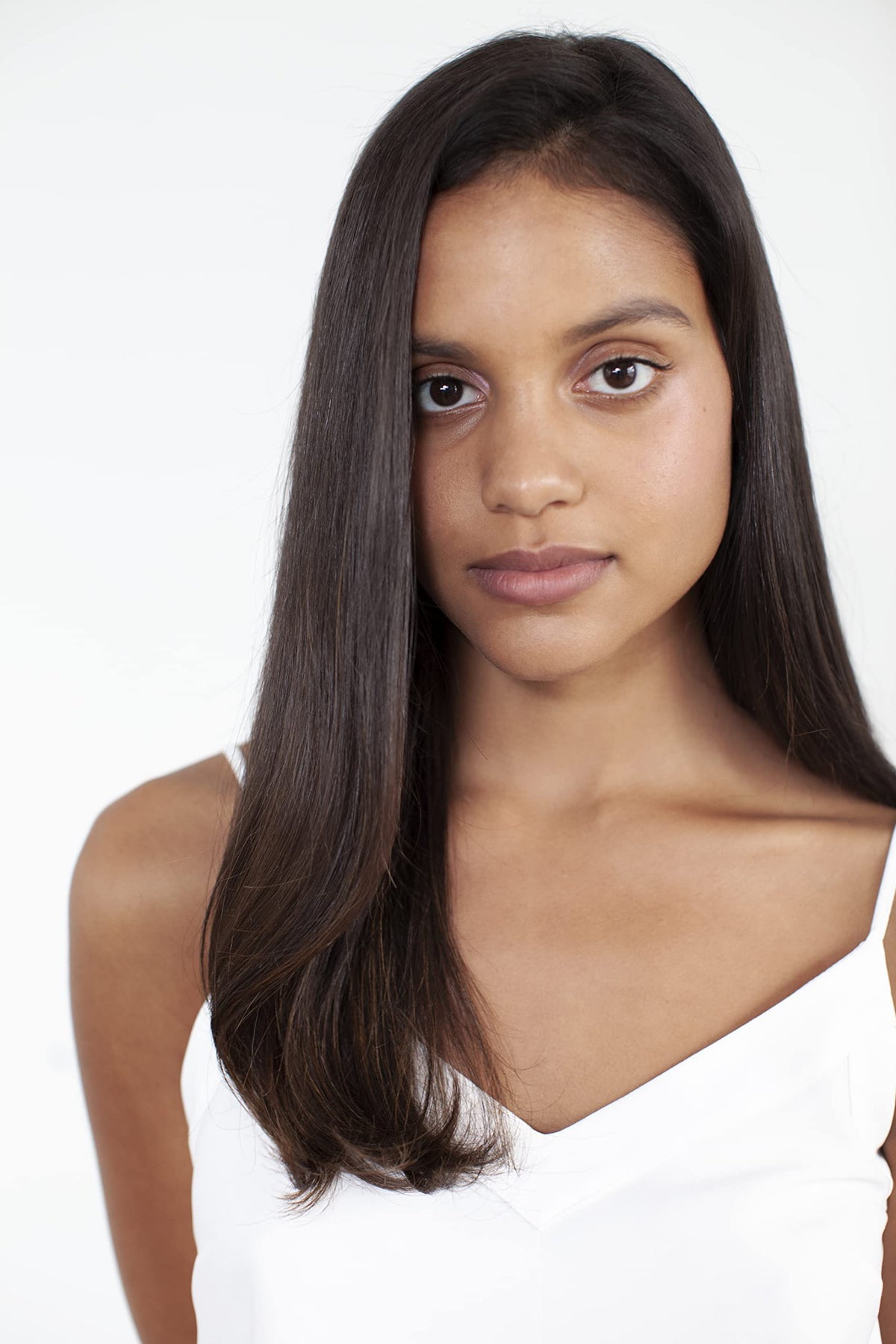 R+Co Moon Landing spray mist applied to hair for quick smoothing.