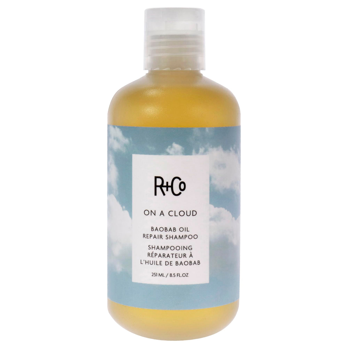 R+Co On A Cloud Baobab Repair Shampoo bottle for gentle cleansing on damaged hair.