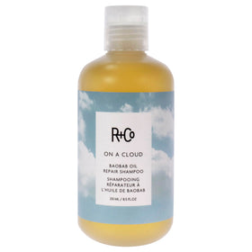 R+Co On A Cloud Baobab Repair Shampoo bottle for gentle cleansing on damaged hair.