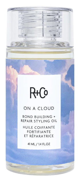 R+Co On a Cloud Bond bottle used for frizz control and shine.