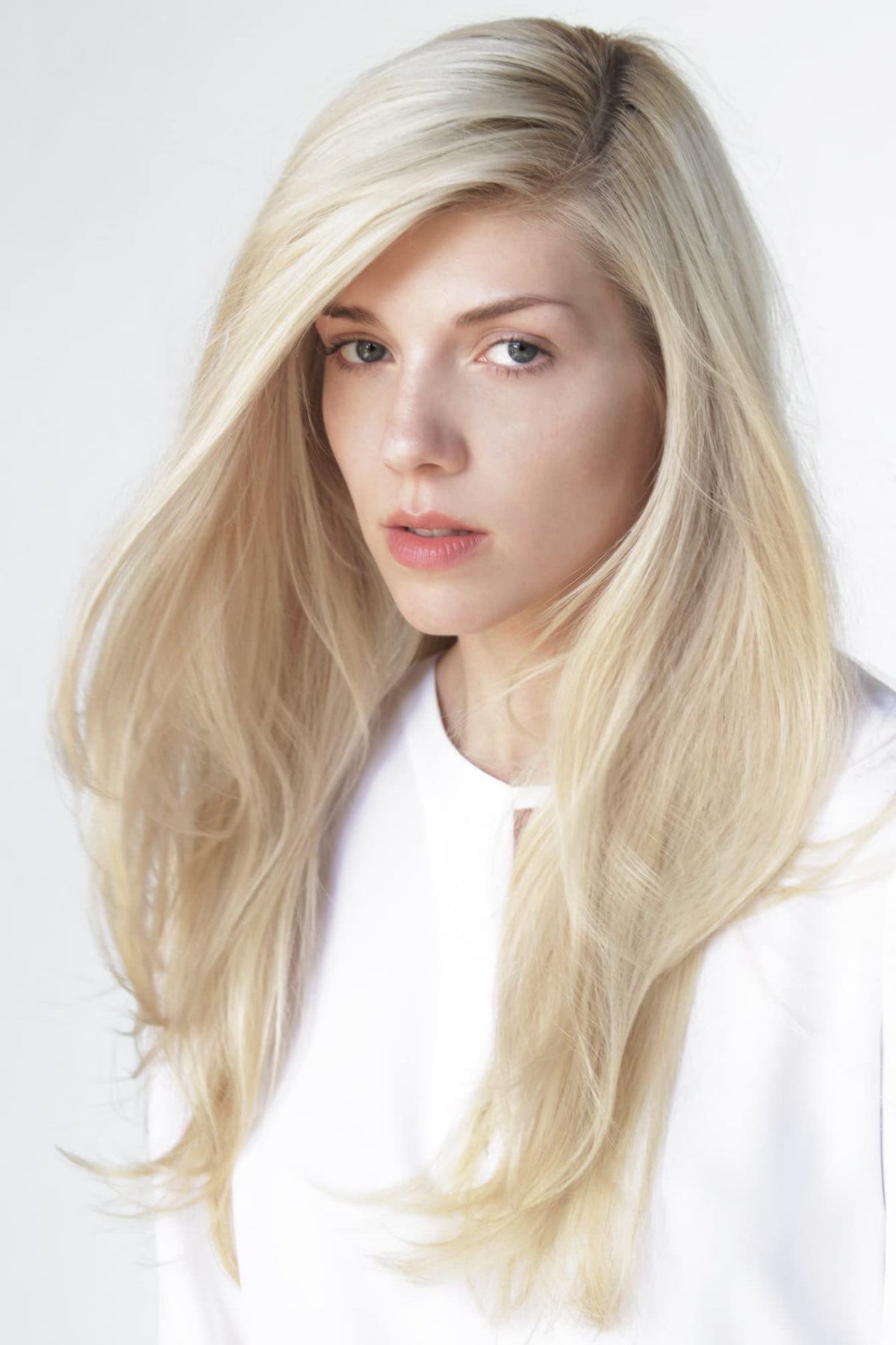 Creamy lather forms on blonde hair with R+Co Sunset Blvd