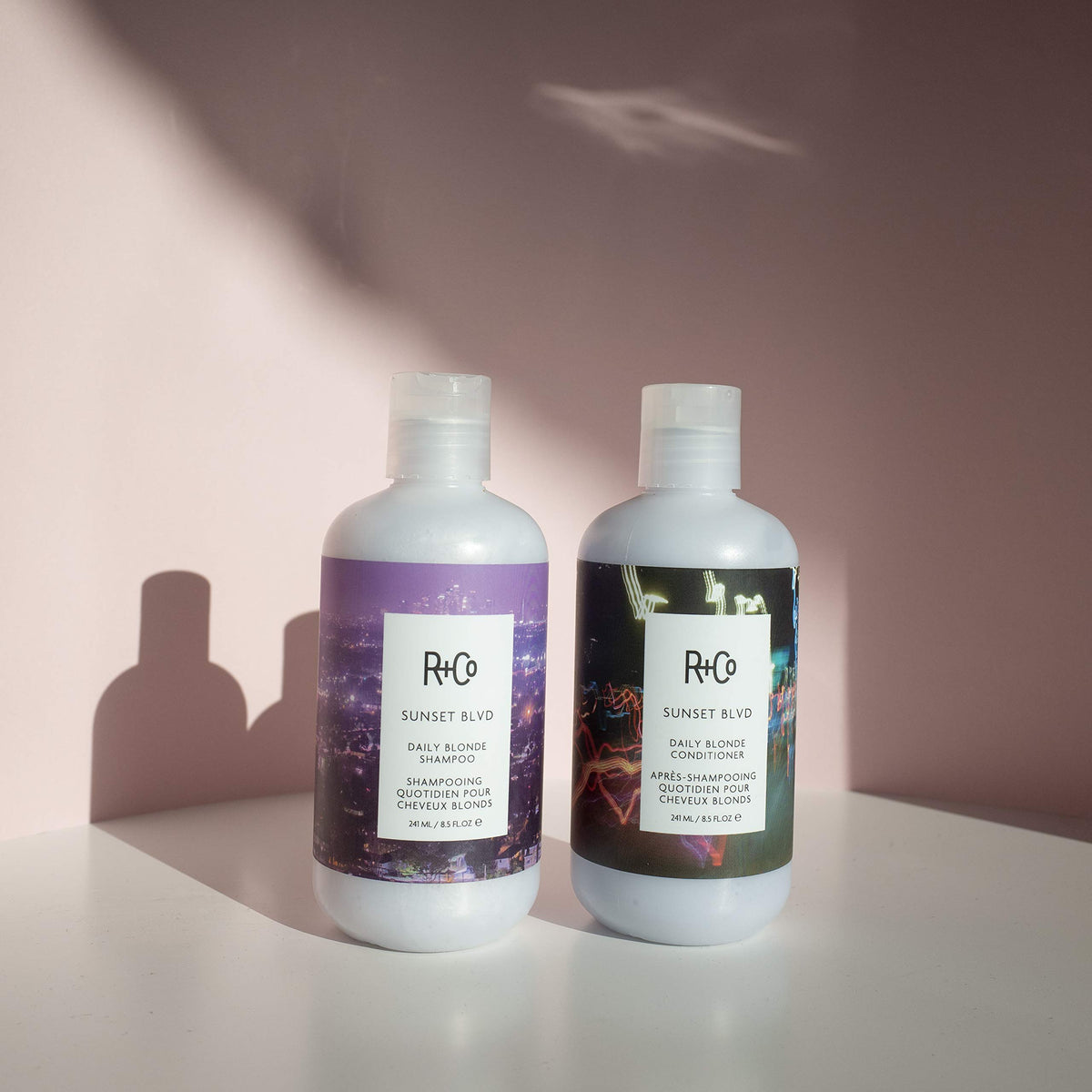 R+Co Sunset Blvd shampoo lather closeup demonstrating gentle daily cleanse.