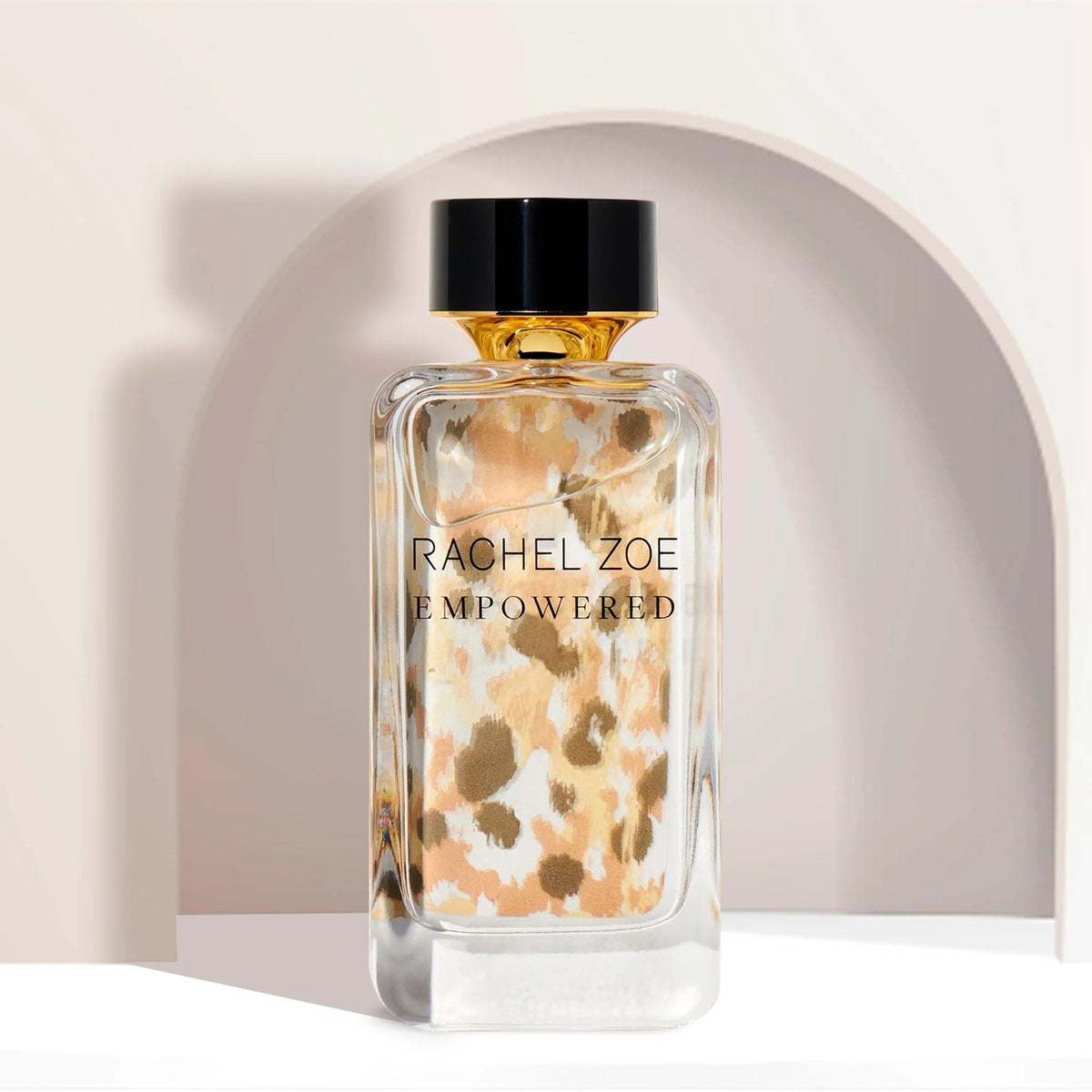 Rachel Zoe Empowered mist spray beside the cap, delivering a smooth, fine mist daily.