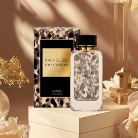 Rachel Zoe Empowered full bottle displayed on a reflective surface for elegant grooming.