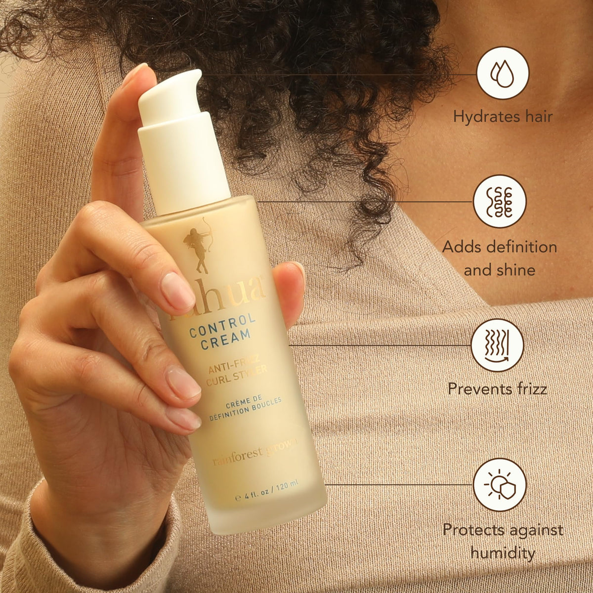 Rahua Control Cream being applied to hair sections for smooth curl definition.