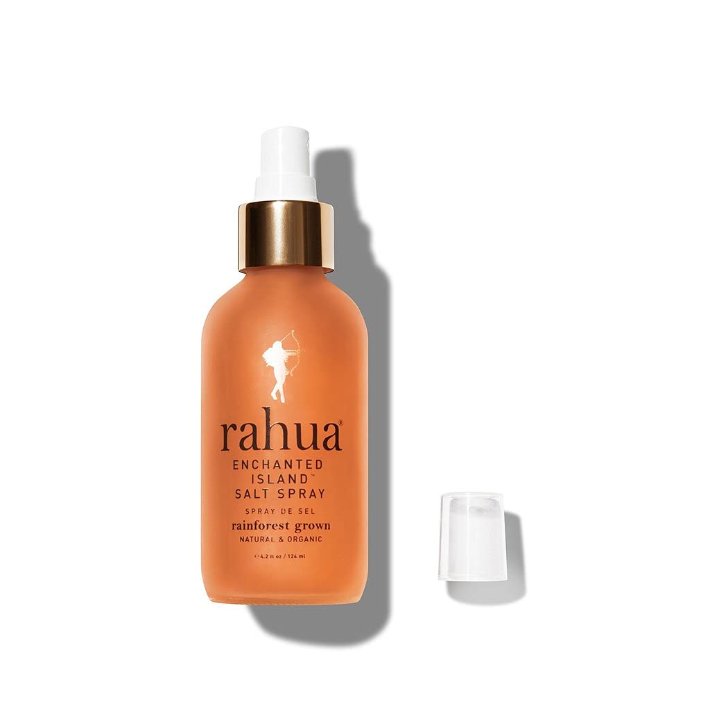 Dispensing Rahua Enchanted Island Salt Spray bottle demonstrating easy application.