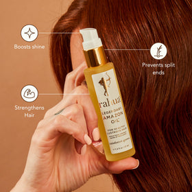 Rahua Women's Legendary Amazon Oil on hair strand; anti-frizz and luminous shine.