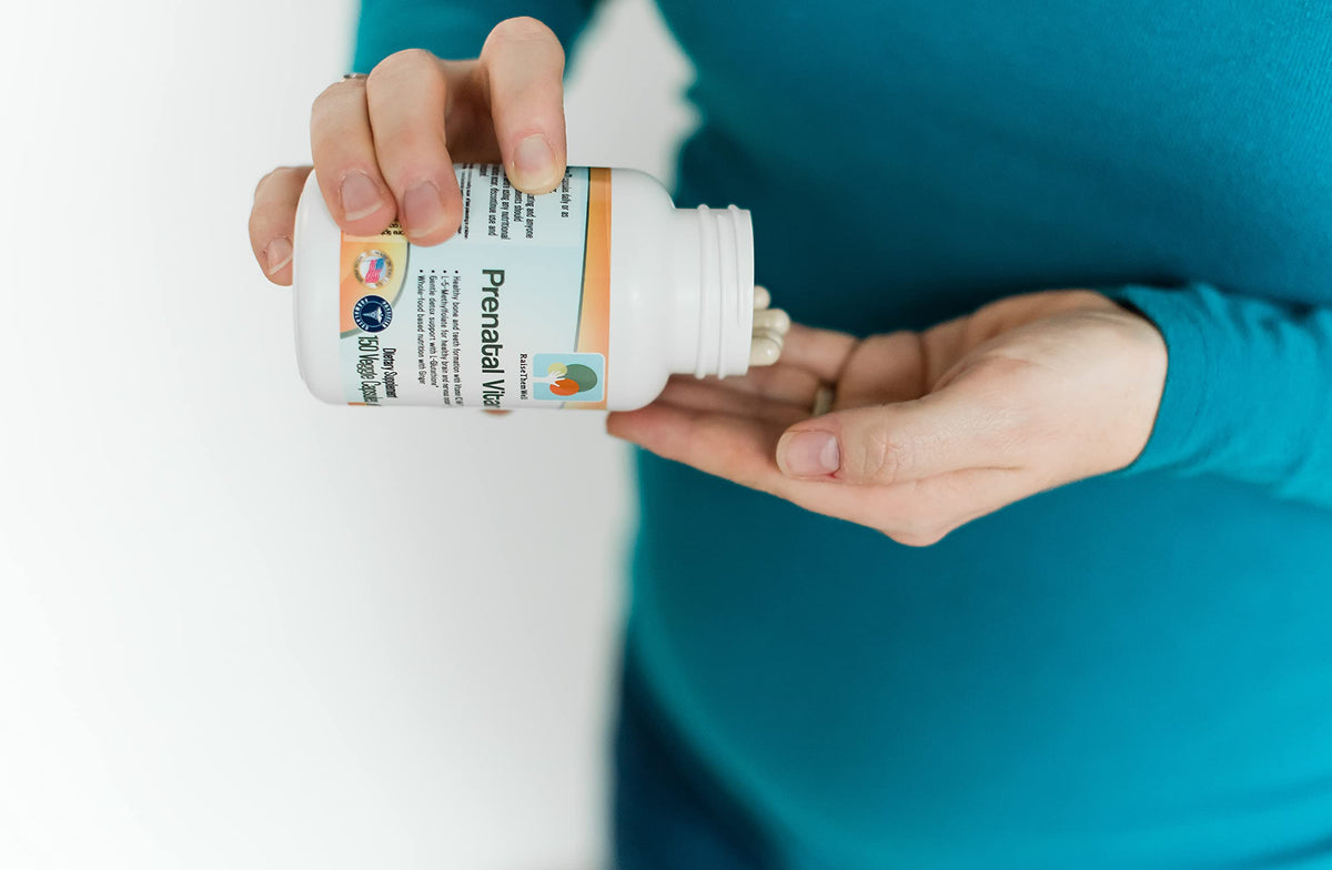 Raise Them Well on-the-go lifestyle shot with a mom-to-be taking the supplement