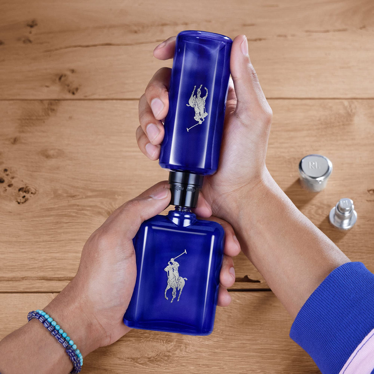 Polo Blue bottle in spray action demonstrating quick fragrance refresh