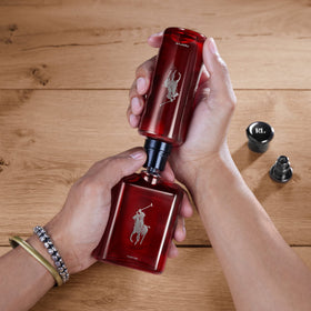 Close-up of cedarwood-absinthe notes in Polo Red Parfum evokes sensual depth.