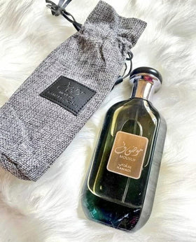 Ramadan24 Mousuf Ramadi bottle side view showcases elegant design.
