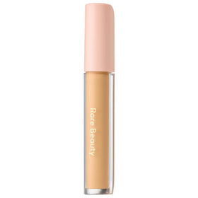 Rare Beauty Under Eye Brightener Cream bottle in medium shade for brightening and hydration.