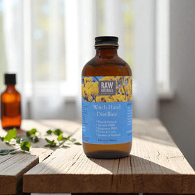 RAW MATERIALS Witch Hazel Distillate on a cotton pad for gentle toning