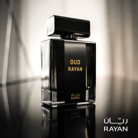 RAYAN Modern Oud perfume bottle on warm surface suggests all-day staying power