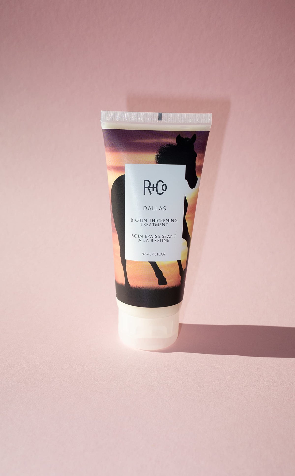 Texture swirl of R+Co Dallas Thickening Treatment showing creamy formula for volume