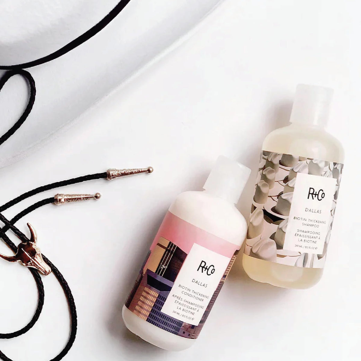 R+Co Dallas Biotin Travel Duo in clear pouches for compact packing