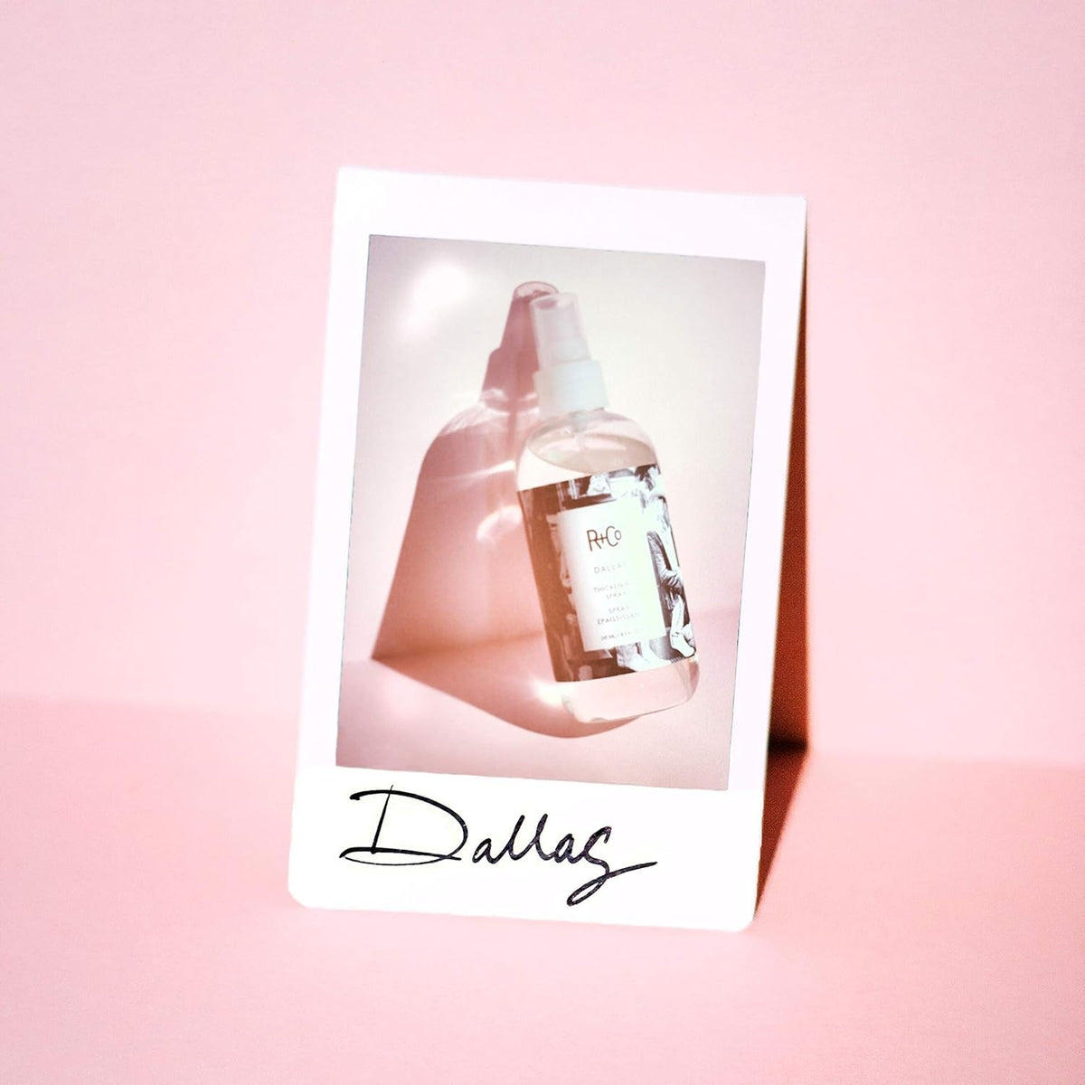R+Co Dallas Thickening Spray finish on hair, adding natural shine.