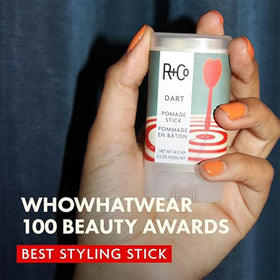 R+Co Dart Pomade Stick smooth-glide texture close-up with a soft finish.