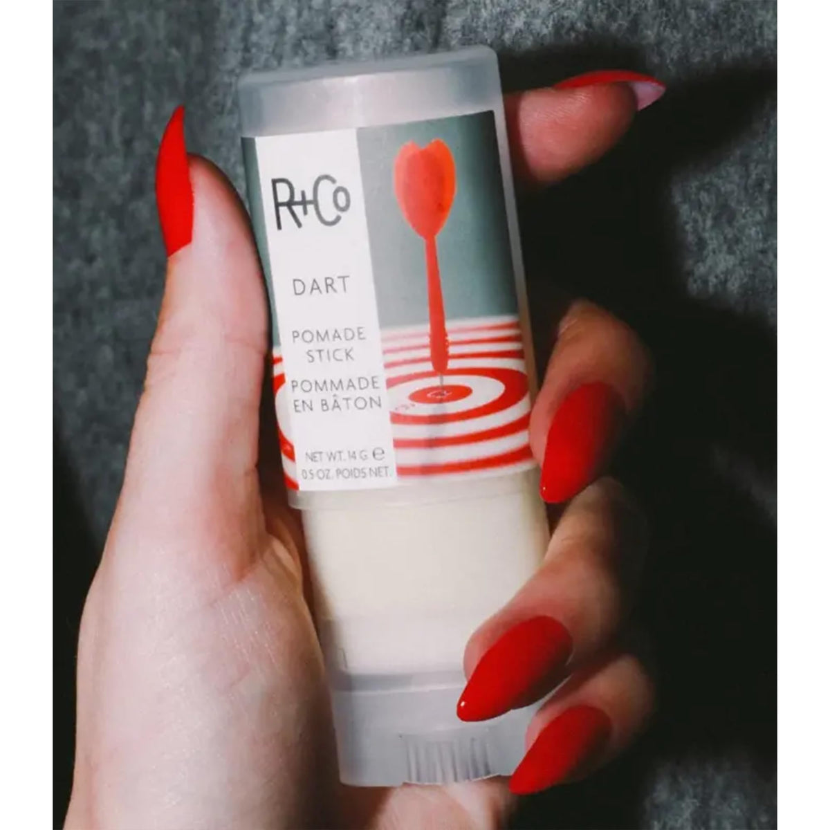 R+Co Dart Pomade Stick travel-size design ideal for quick touch-ups.