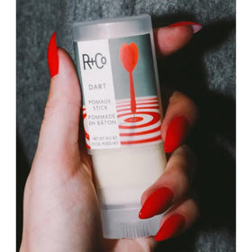 R+Co Dart Pomade Stick travel-size design ideal for quick touch-ups.