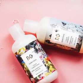 R+Co Gemstone Color conditioner on hair texture swatch suggests vibrant color retention.