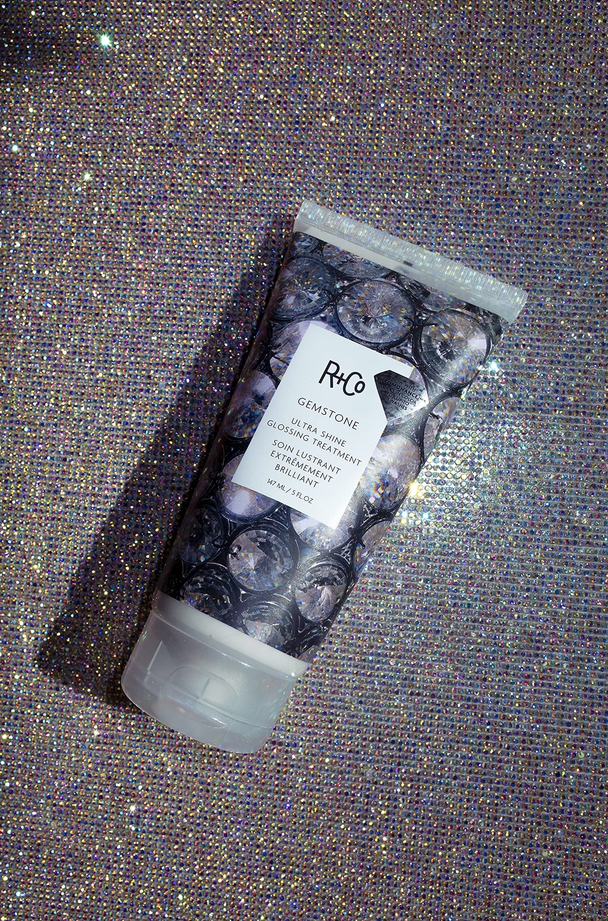 Glossy hair reflects light, illustrating UV protection and sealed cuticles
