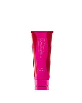 R+Co Rebounce cream bottle close-up promoting shiny, hydrated curls.