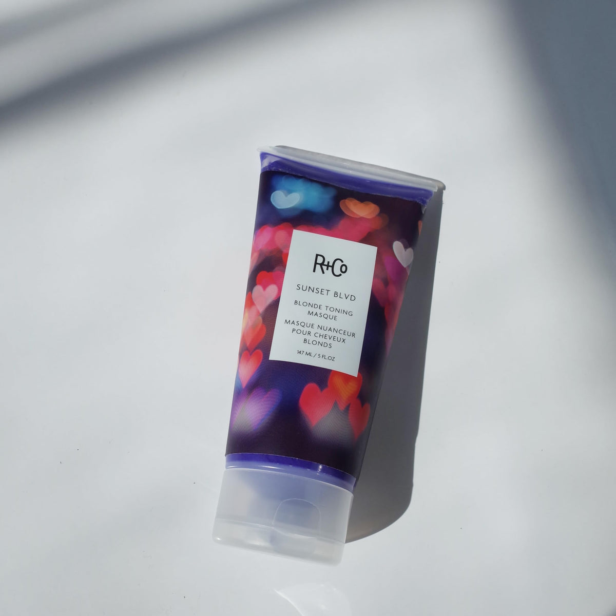 R+Co Sunset Blvd product on model showing detangled, soft, luminous hair