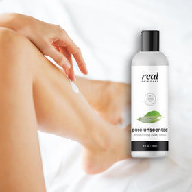 Real Skin Care Organic Body Lotion being applied to skin for lasting moisture.