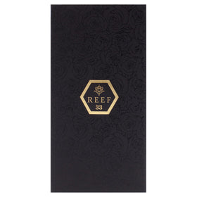 Reef No-33 EDP wooden-cap detail, refined craftsmanship and luxury feel.