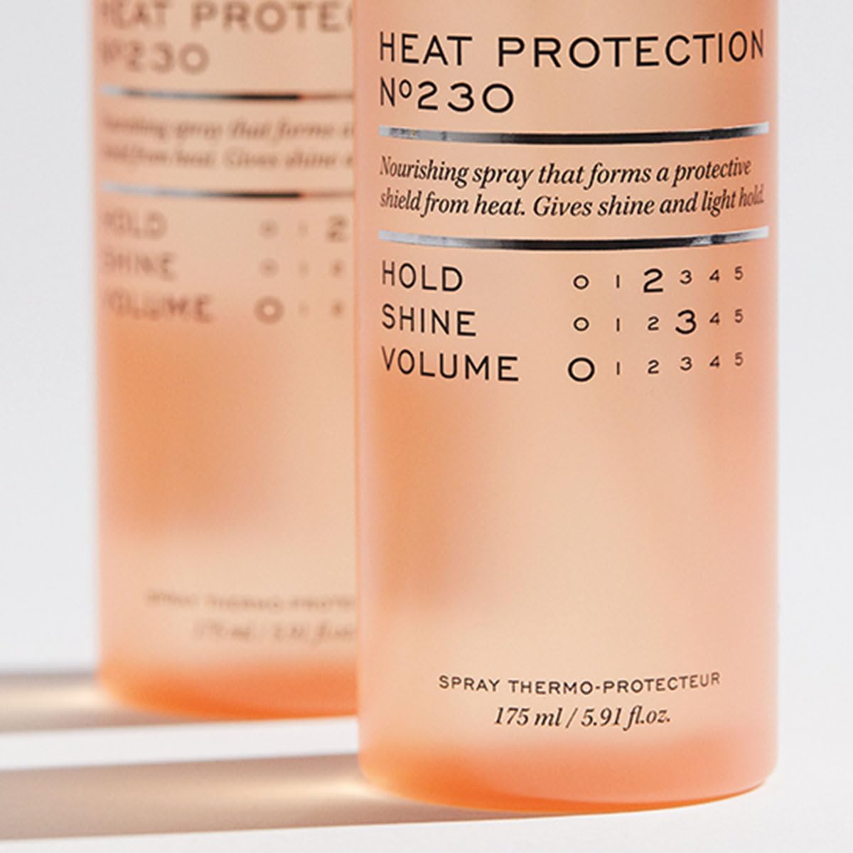 REF Reference 230 spray bottle demonstrates light hold and shine during heat styling