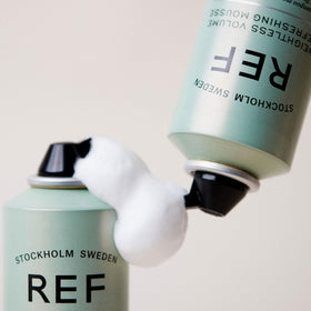 REF Weightless Volume Mousse root application demonstrates easy usage for lasting volume.