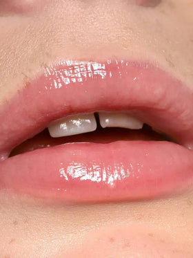 REFY Lip Gloss Blush applied on lips for a smooth, glossy finish