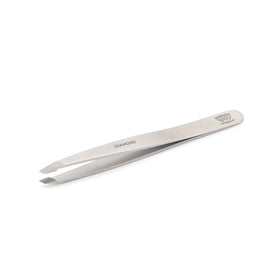 Regine facial and eyebrow grooming with precise tips.