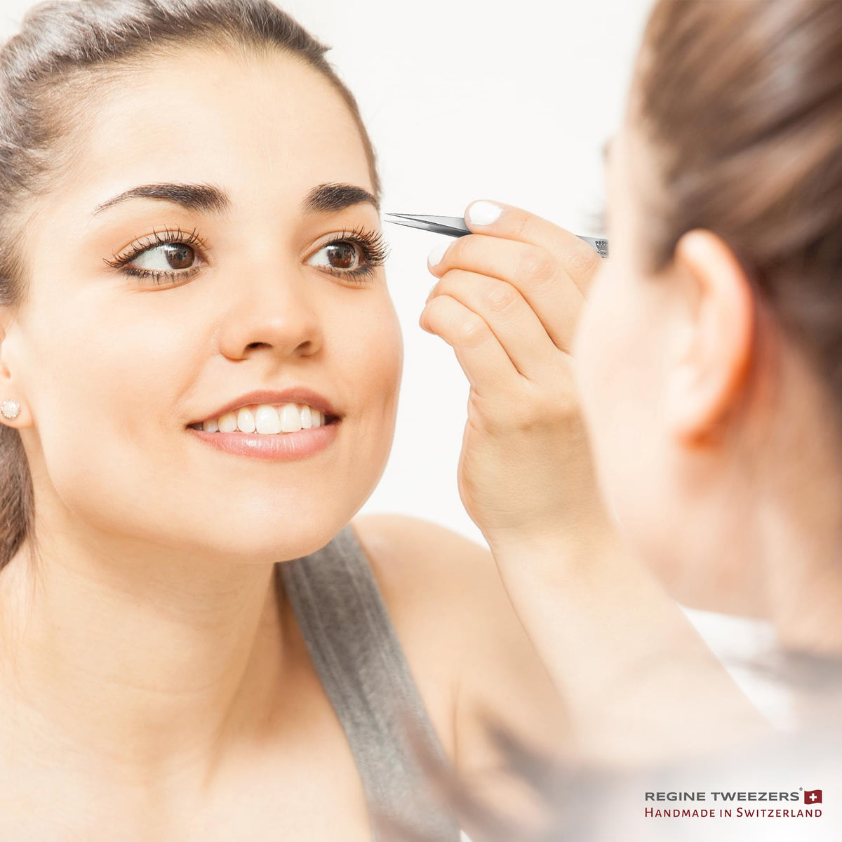Regine Switzerland silver-finish tweezers ideal for facial and body care tasks.